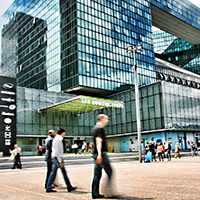People walking infron of a building