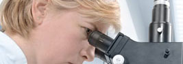 scientist with microscope