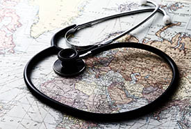 Stethoscope and a world map