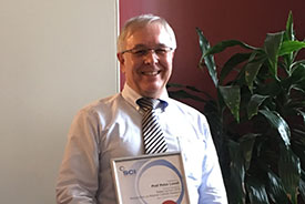 Lovell with award
