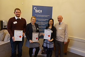 Previous winners, Thomas Britten, Isobel Mackay, and Kay Yeung with Alan Heaton.