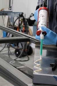 Person applying adhesive