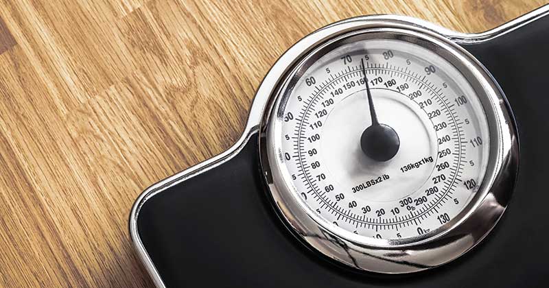 Weighing scales on wooden flooring