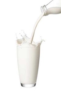 Milk being poured into a glass
