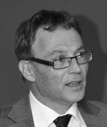 Black and white headshot of Peter Maienfisch