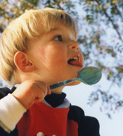 child with spoon