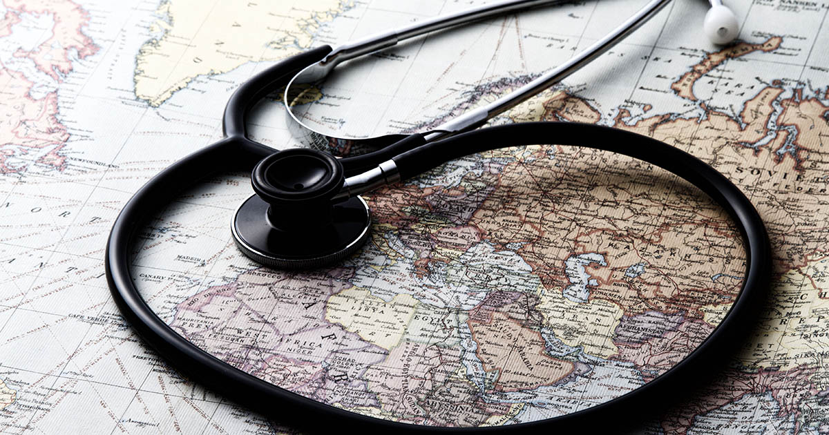 Stethoscope and world map 