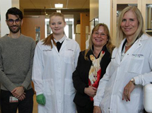Elizabeth Winzeler, PhD (right), and her malaria research team at UC San Diego School of Medicine.
