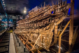 A technician services the spraying system on the Mary Rose.