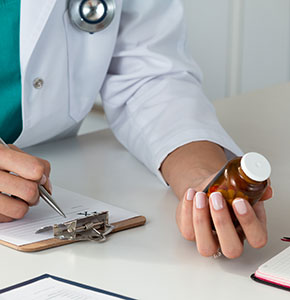 /-/media/images/news/2021/2/femaledoctorwritingprescriptionholdingpillslandin.ashx?h=300&w=290&hash=890B640F7951F53DCA6A366D323CE950
