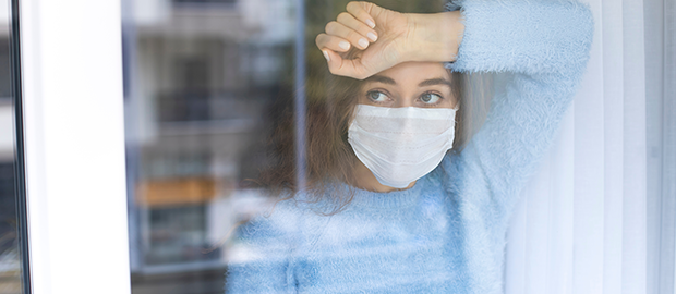PoliSCI newsletter 23rd February 2021 - image of a woman behind a window of her house