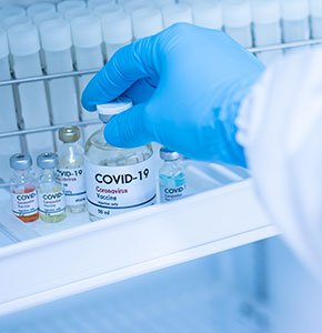 /-/media/images/news/2021/7/doctorshandholdingcovid19vaccineincoldstoragelanding.ashx?h=300&w=290&hash=3FD63BB89E618638ECA4A52E2D1B63DF
