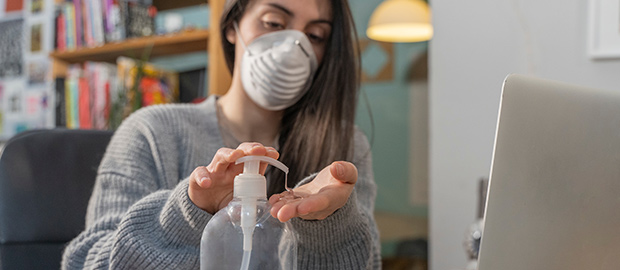 SCI newsletter - PoliSCI - 21 September 2021 - image of a woman working from home using antibac gel