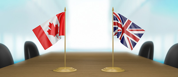 PoliSCI - 31 March 2022 - Canada UK Trade Deal Talks - image of Canadian and UK flags on a board table