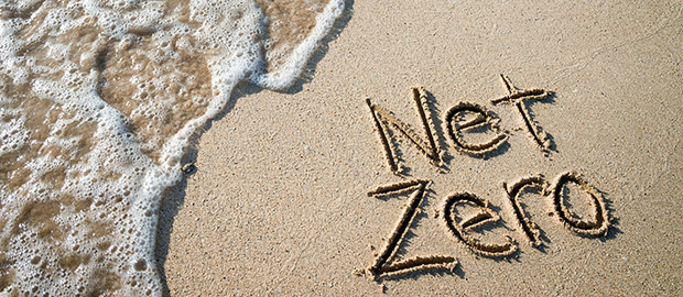 PoliSCI - 07 April 2022 - Cop 26 update - image of net zero written in the sand on a beach