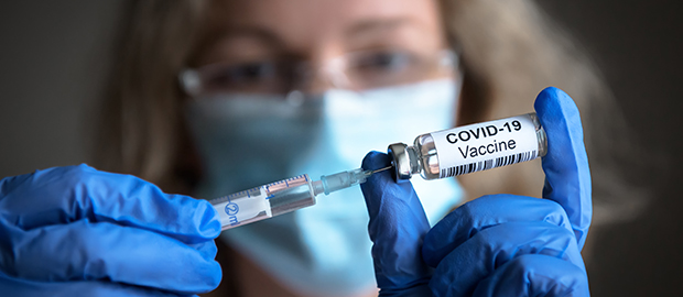 Scientist with Covid-19 vaccine