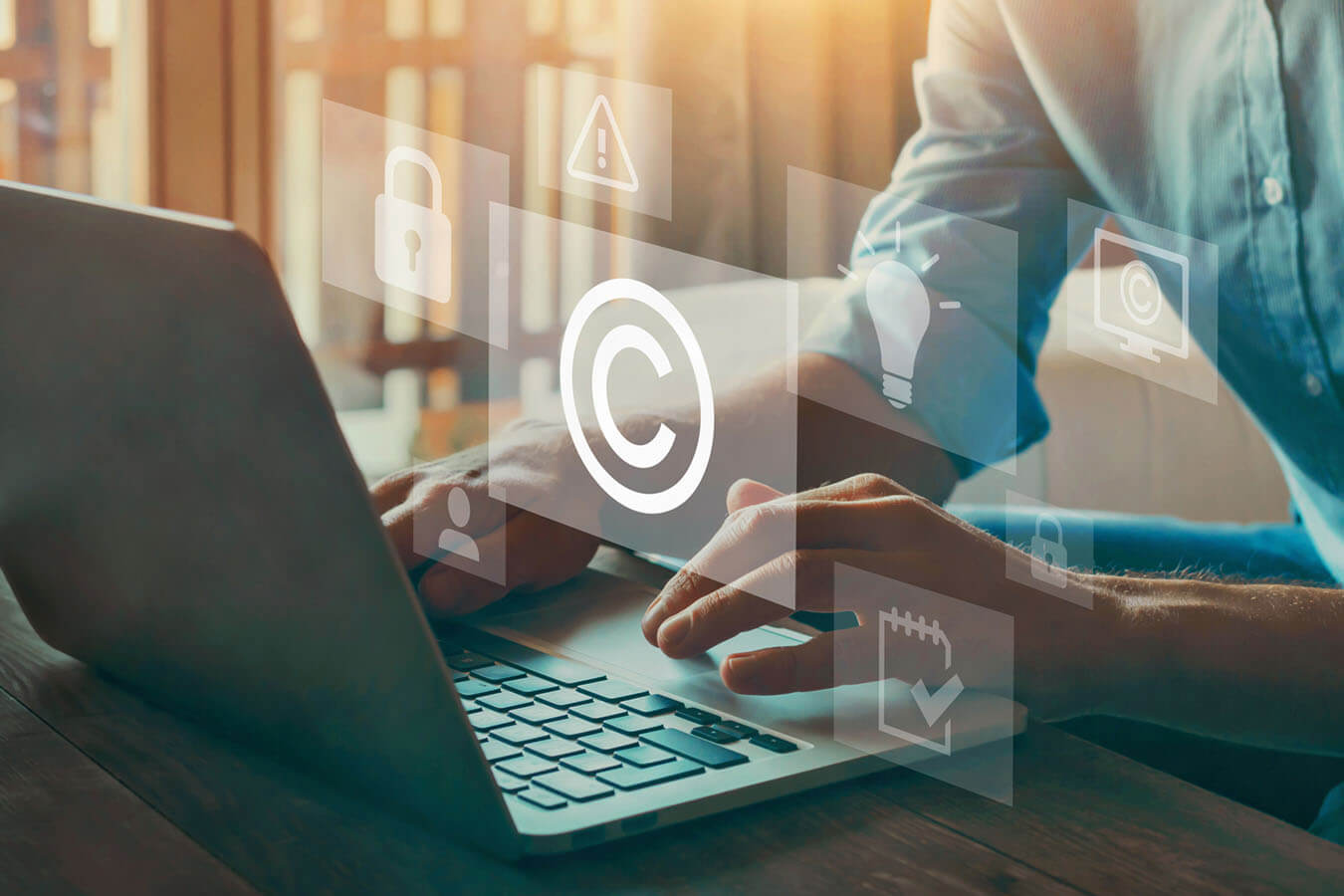 Person using laptop with security, legal and copyright concept