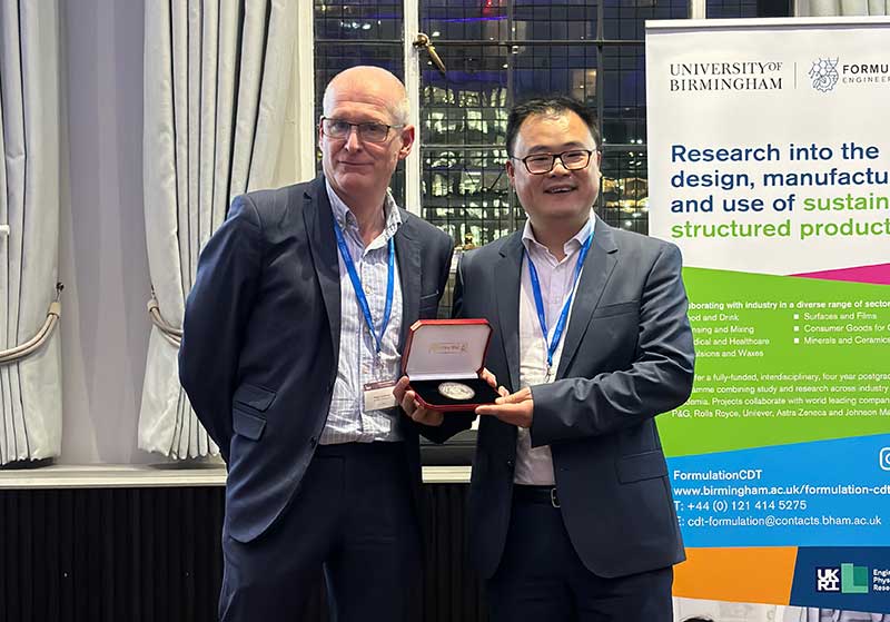Prof Jason Zhang presented with the 2023 McBain Medal by Dr Richard Greenwood
