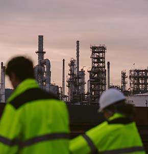/-/media/images/news/2025/12/two-industrial-workers-with-refinery-listing.ashx?h=300&w=290&hash=6A479BA6AD70A4B718CD931090003ED9