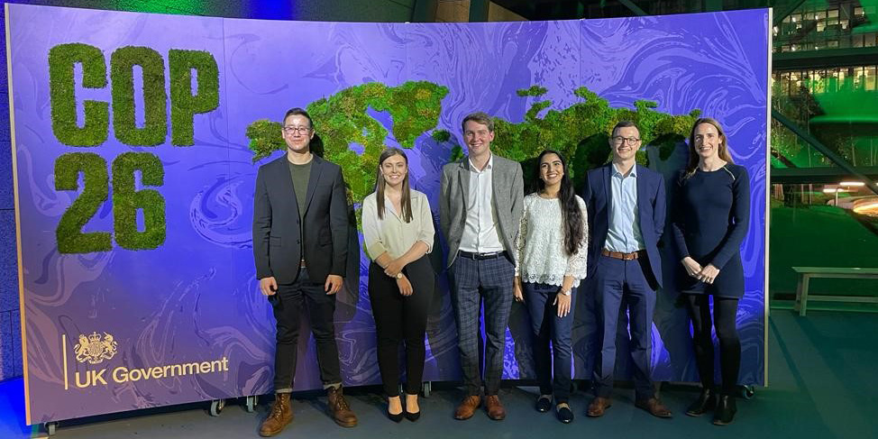 SCIblog - 5 November 2021 - COP 26: Young scientists combat climate change with chemistry - Social image of the panel in front of COP26 banner