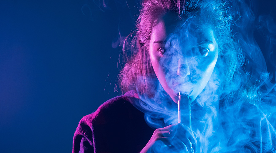 SCIBlog - 14 December 2022 - image of woman vaping in purple light