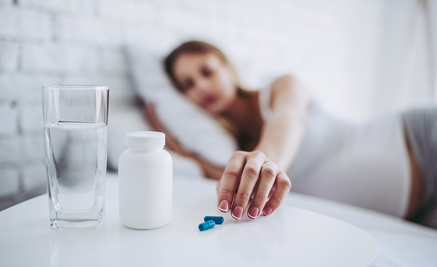 SCIBlog - 19 August 2022 - image women lying down reaching for pill